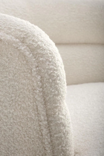 Fotel kubełkowy Mayi nowoczesny do salonu i biura kremowy bouclé z podnóżkiem Intesi