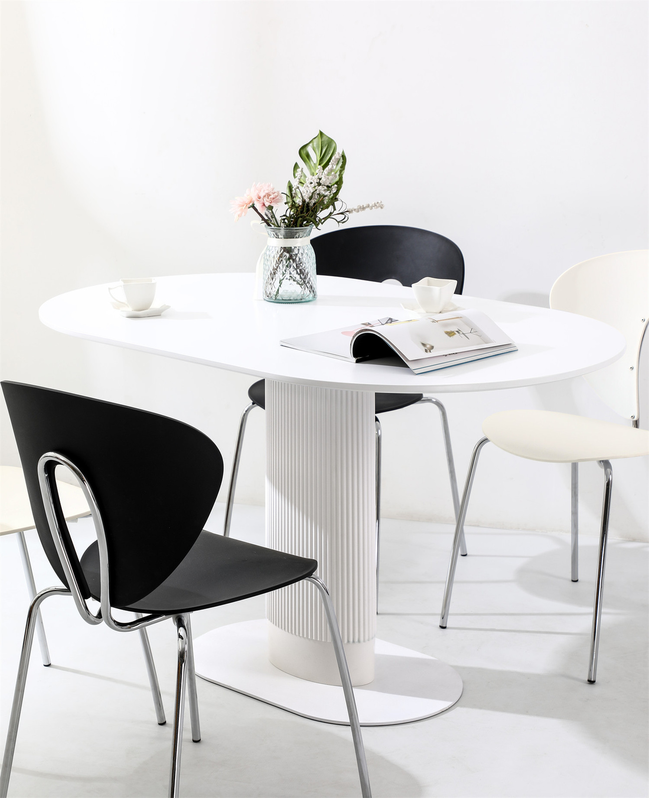 Stół do jadalni Maxim biały owalny nowoczesny na jednej nodze 120x70 cm Intesi