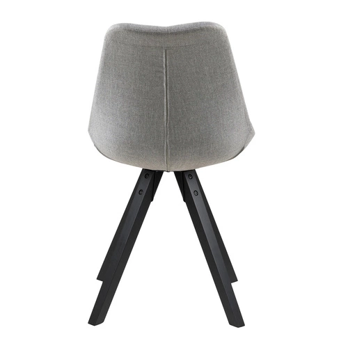 Krzesło Dima Actona tapicerowane szare skandynawskie z czarnymi drewnianymi nogami do jadalni