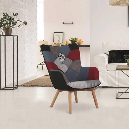 Fotel uszak patchwork Intesi do salonu skandynawski wysoki nogi dekoracyjny multikolor