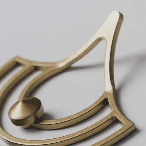 Wieszak ścienny metalowy złoty Husk XS nowoczesny do przedpokoju i garderoby POLYHEDRA