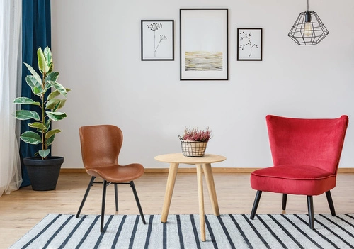 Krzesło tapicerowane Batilda ekoskóra brązowa na czarnych nogach do jadalni nowoczesne Actona