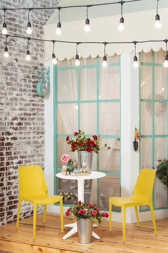 Krzesło ogrodowe Ginevra żółte z tworzywa sztaplowane nowoczesne do ogrodu i na taras SCAB Design