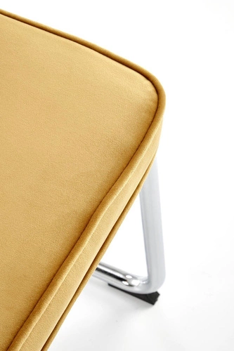Krzesło tapicerowane Nelson Intesi welurowe musztardowe na płozach do jadalni nowoczesne