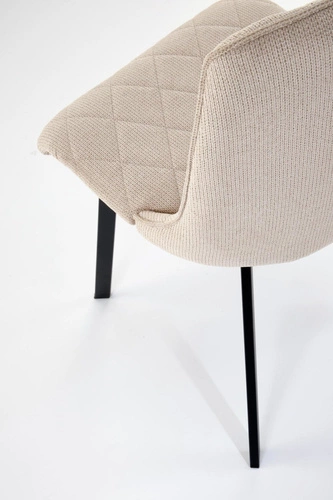 Krzesło tapicerowane Fenri beżowe do jadalni i salonu nowoczesne pikowane na czarnych nogach
