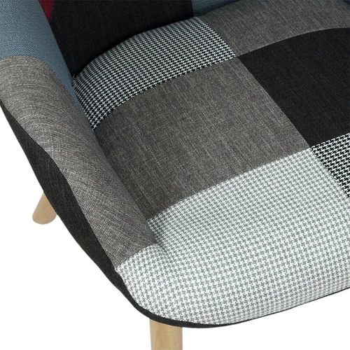 Fotel uszak patchwork Intesi do salonu skandynawski wysoki nogi dekoracyjny multikolor