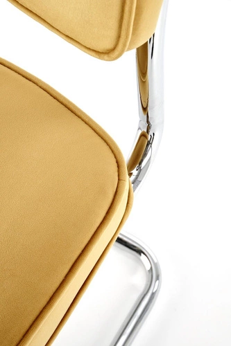 Krzesło tapicerowane Nelson Intesi welurowe musztardowe na płozach do jadalni nowoczesne