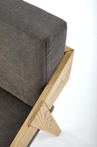 Fotel kubełkowy Davero szary skandynawski z dębowymi nogami do salonu tapicerowany