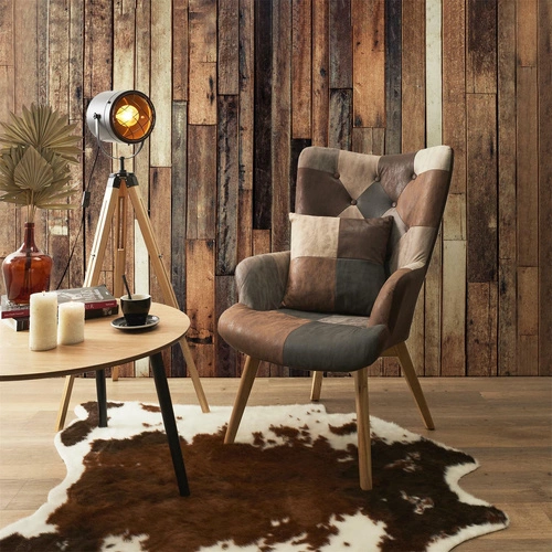 Fotel uszak Helsinki do salonu brązowy patchwork skandynawski z wysokimi nogami Intesi