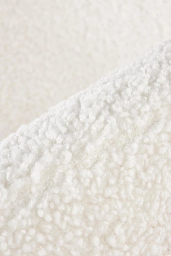 Fotel wypoczynkowy Eder kremowy do salonu tapicerowany boucle na drewnianych nogach Intesi