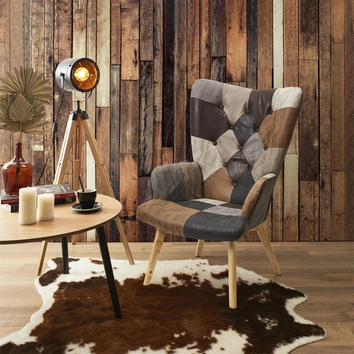 Fotel uszak Helsinki do salonu brązowy patchwork skandynawski z wysokimi nogami Intesi