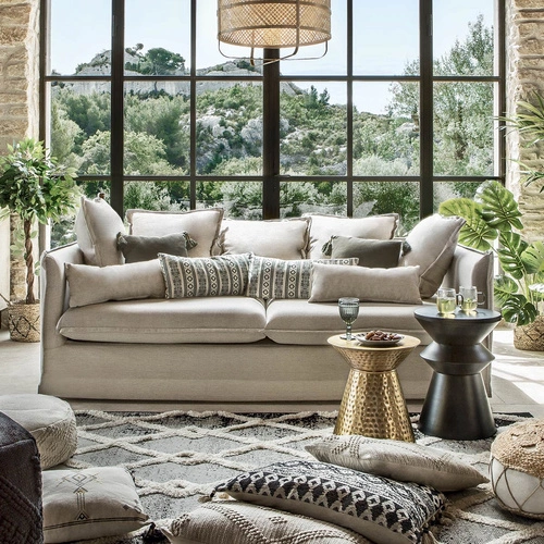 Sofa trzyosobowa Odilon beżowa tapicerowana do salonu boho na drewnianych nogach Atmosphera