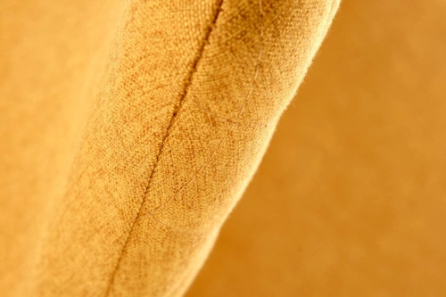 Krzesło tapicerowane Honorine żółte do jadalni nowoczesne z czarnymi nogami Intesi