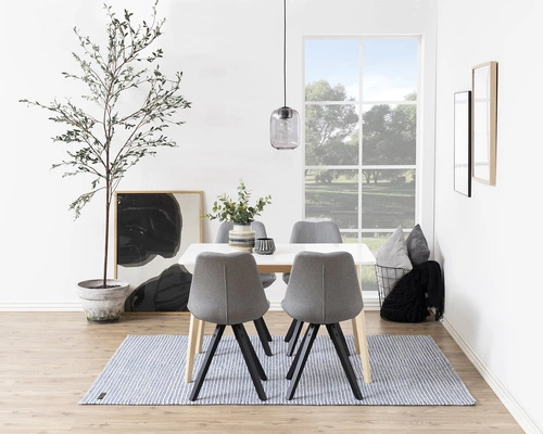 Krzesło Dima Actona tapicerowane szare skandynawskie z czarnymi drewnianymi nogami do jadalni