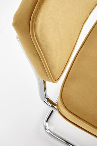 Krzesło tapicerowane Nelson Intesi welurowe musztardowe na płozach do jadalni nowoczesne