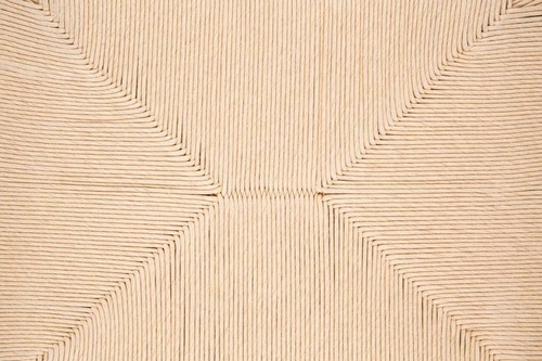 Fotel wypoczynkowy Carson boho z plecionym siedziskiem z dębu beżowy do salonu Actona